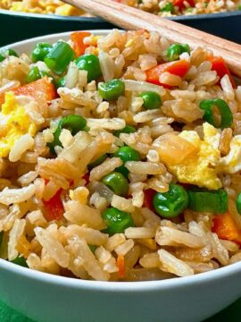 Fried rice in a bowl with chopsticks