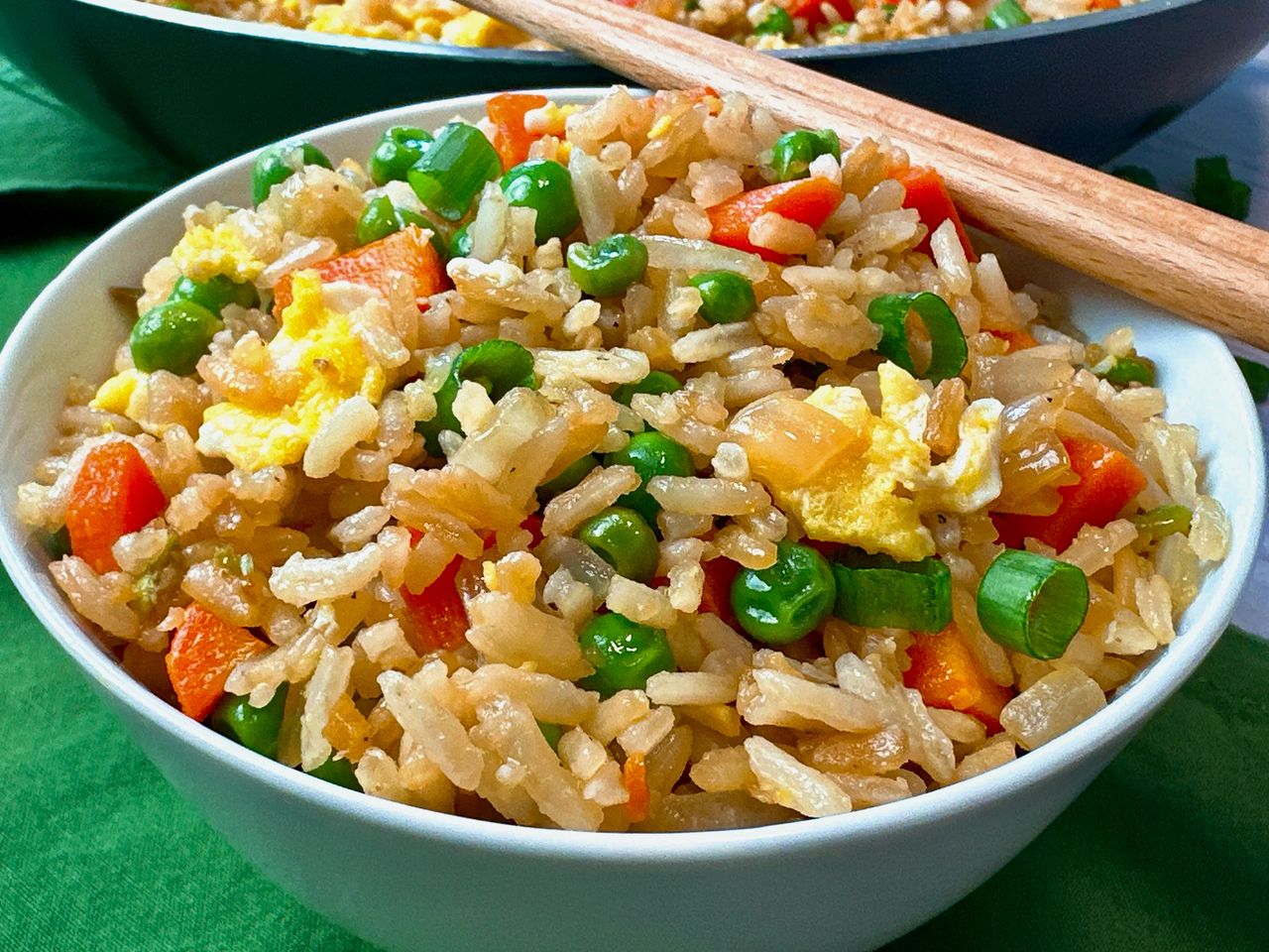 Fried rice in a bowl with chopsticks