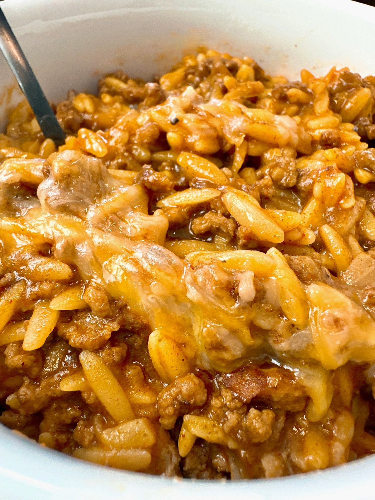 ground beef and pasta in a white bowl