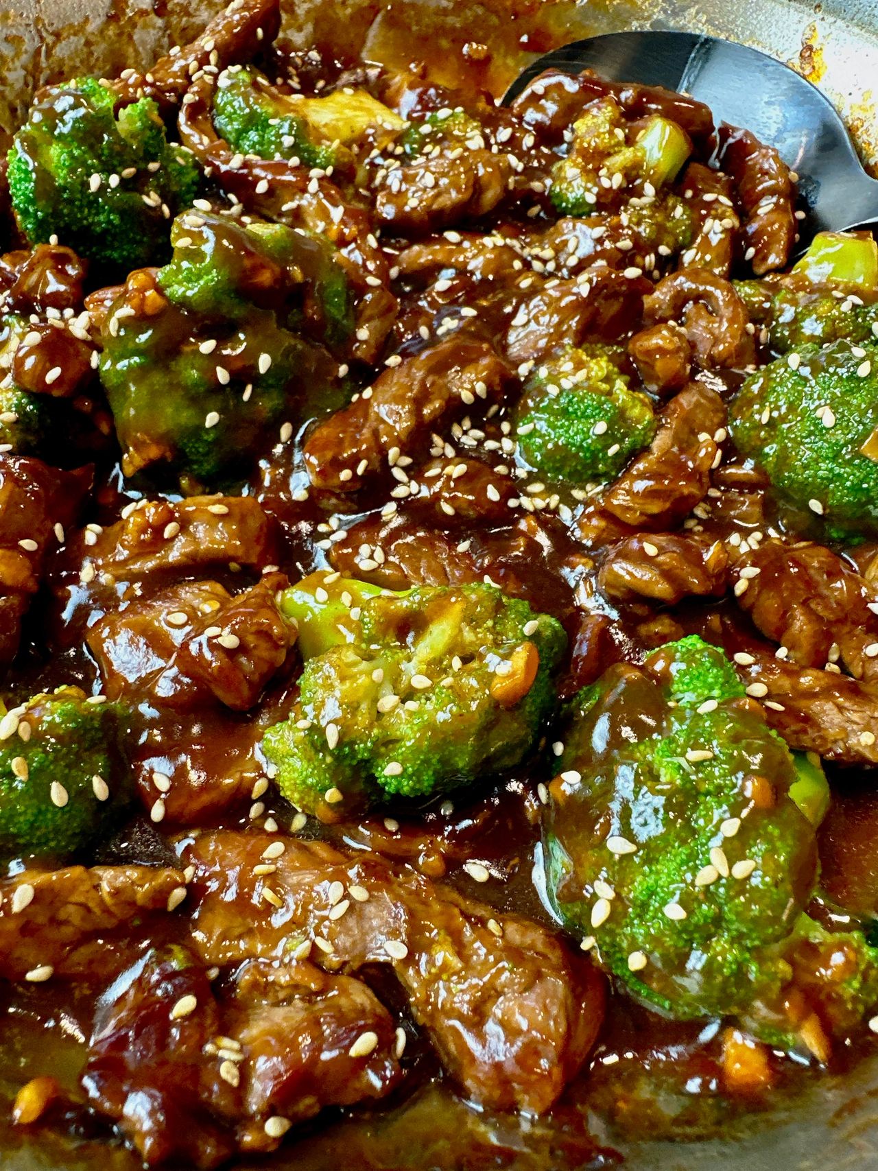beef and broccoli in a skillet
