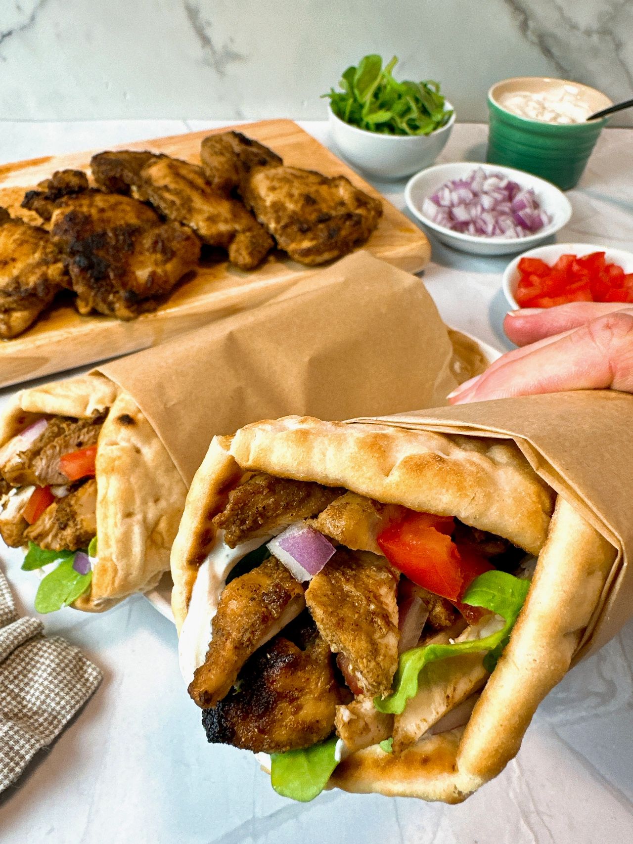 chicken shawarma wraps on a white plate
