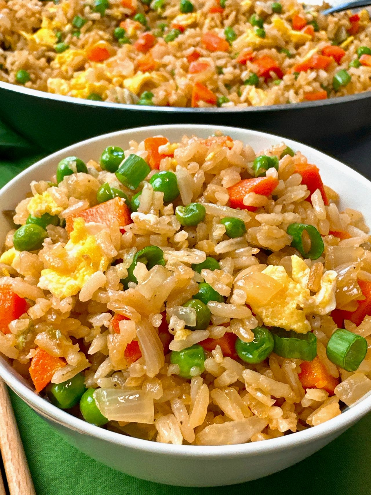 Fried rice in a bowl with chopsticks