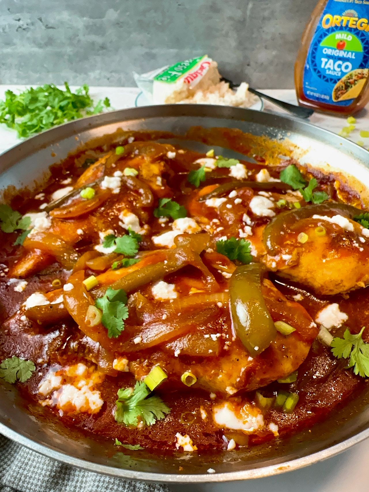 taco chicken and peppers in a skillet
