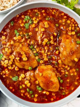 enchilada chicken thighs with corn and peas