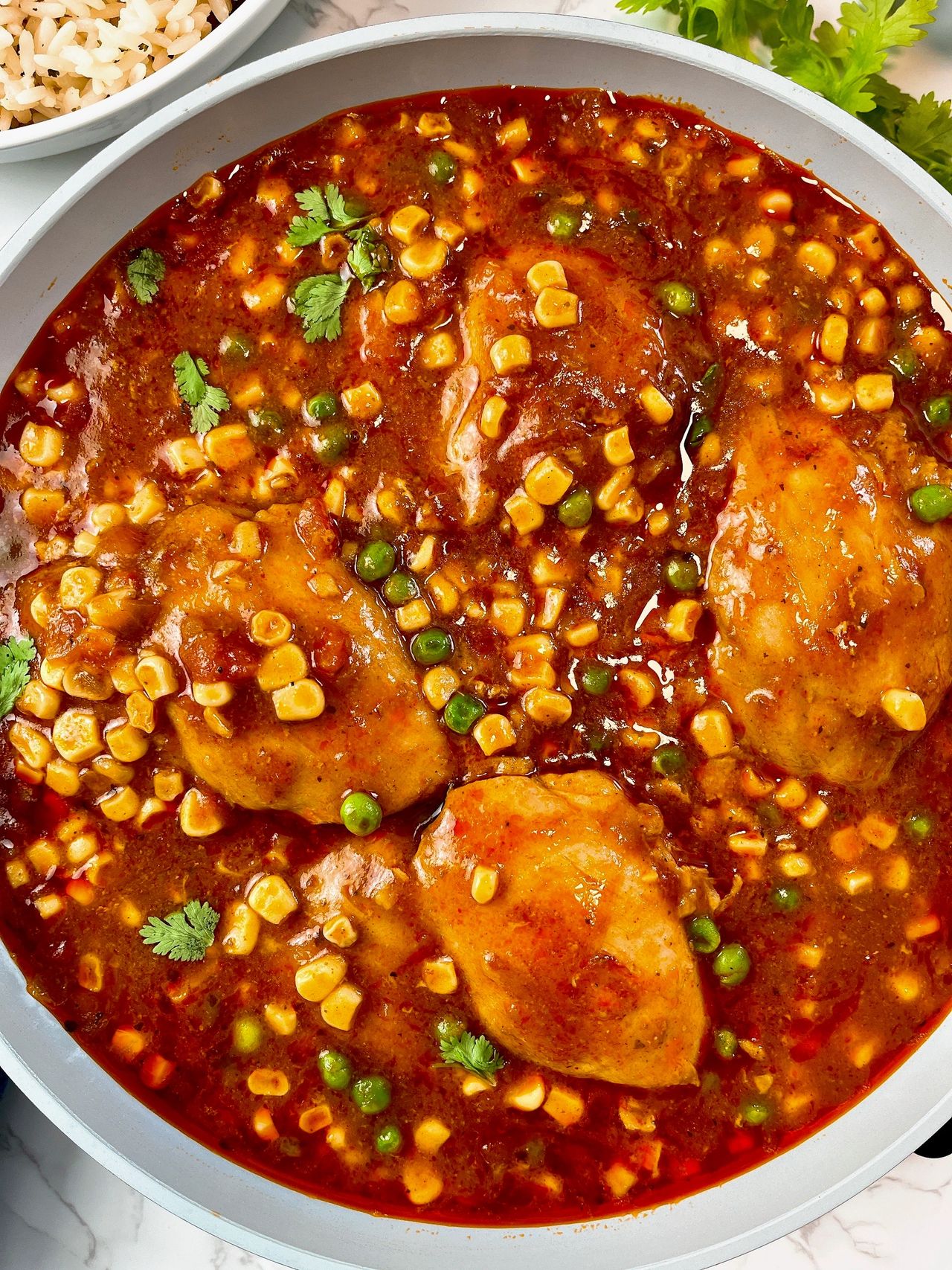 Enchilada Chicken Thighs enchilada chicken thighs with corn and peas
