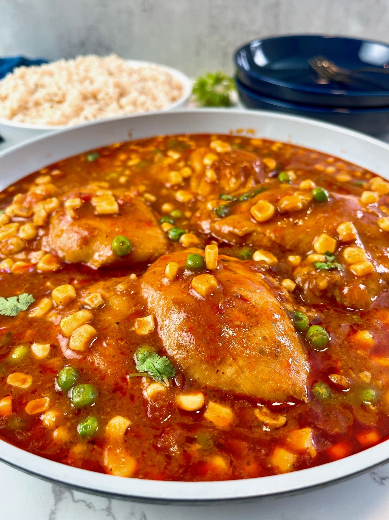 enchilada chicken thighs with corn and peas
