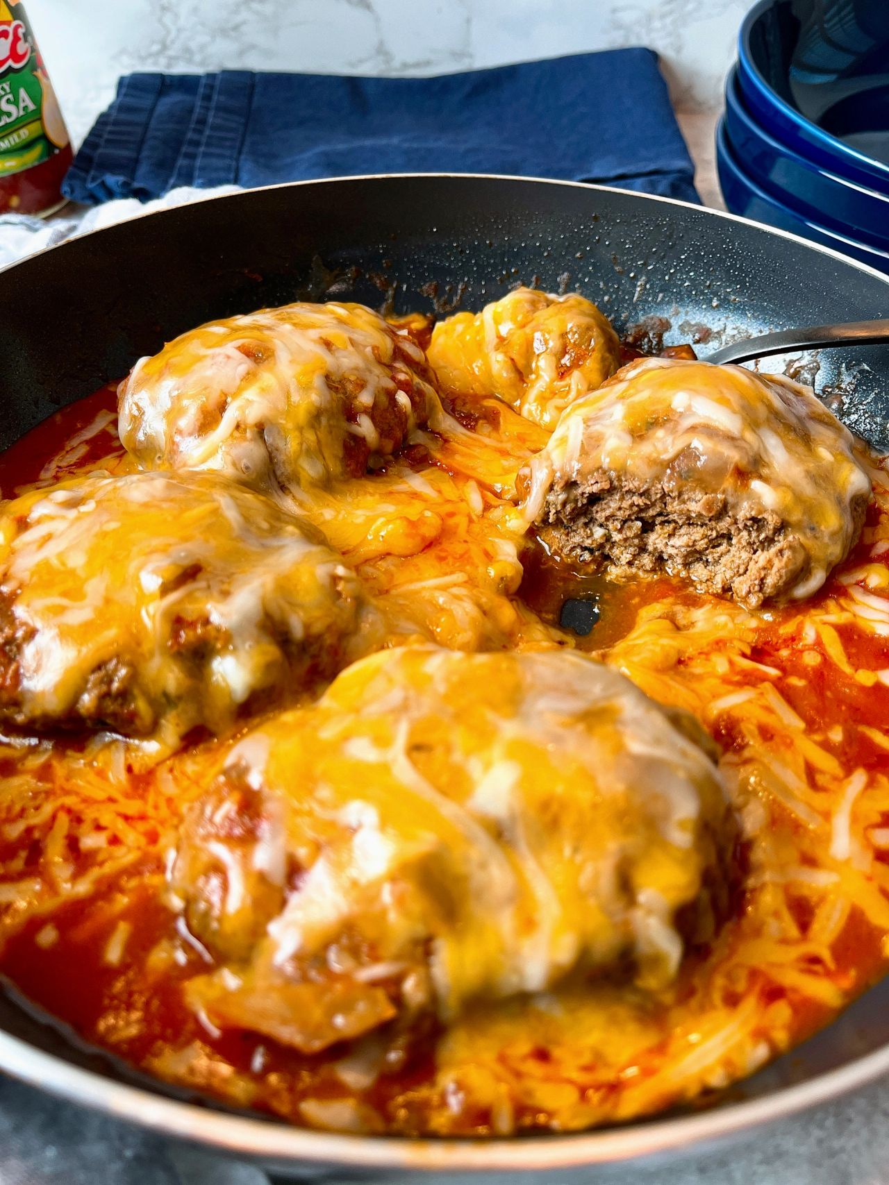salisbury steaks with salsa and cheese