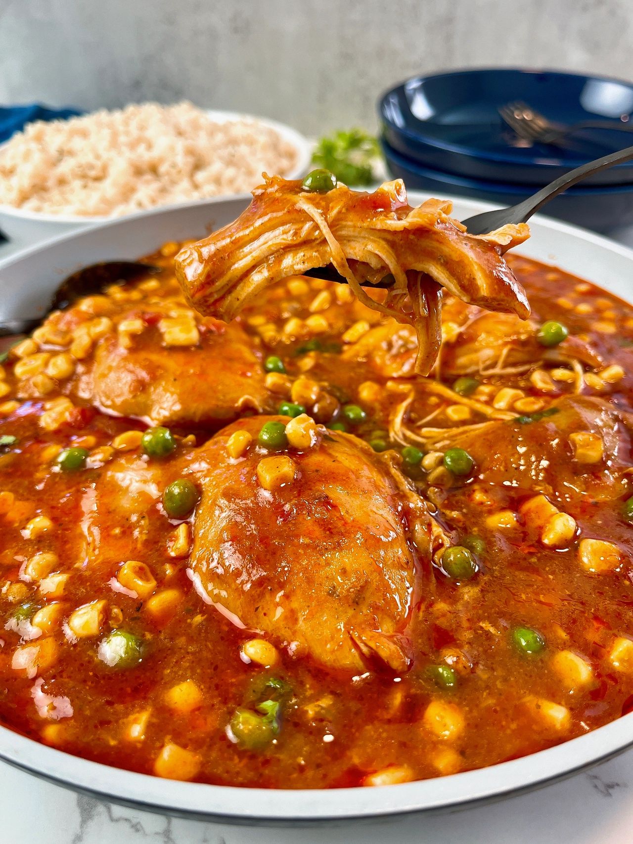 enchilada chicken thighs with corn and peas