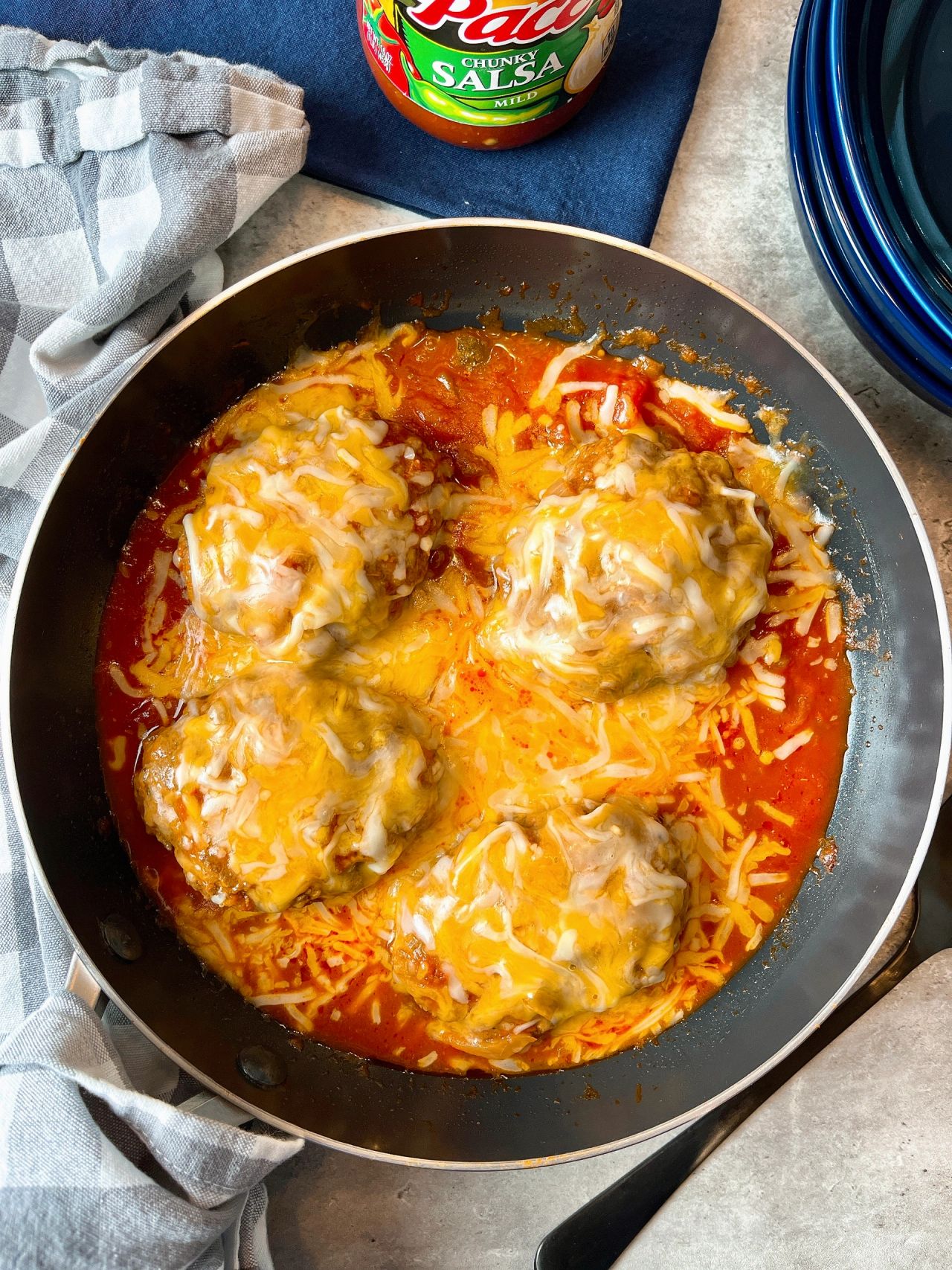salisbury steaks with salsa and cheese