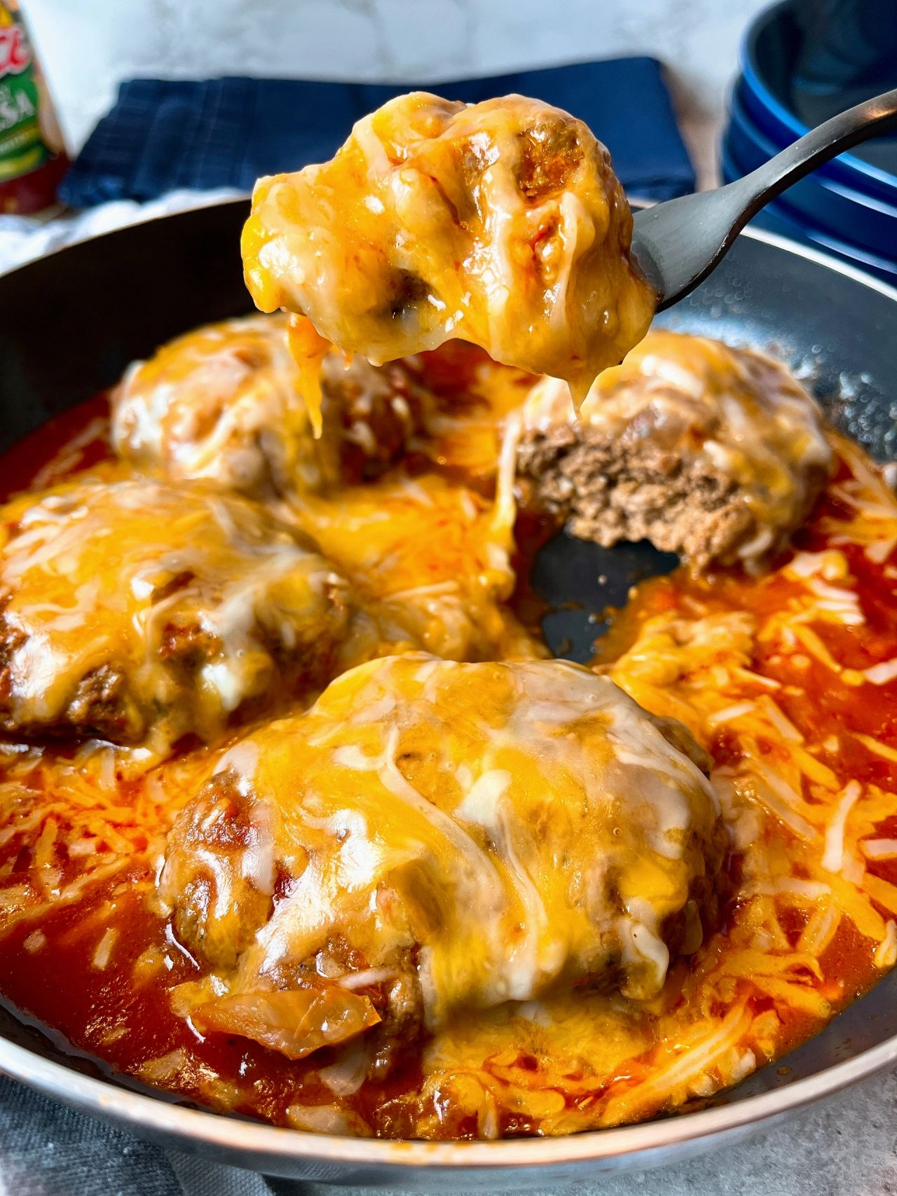 salisbury steaks with salsa and cheese