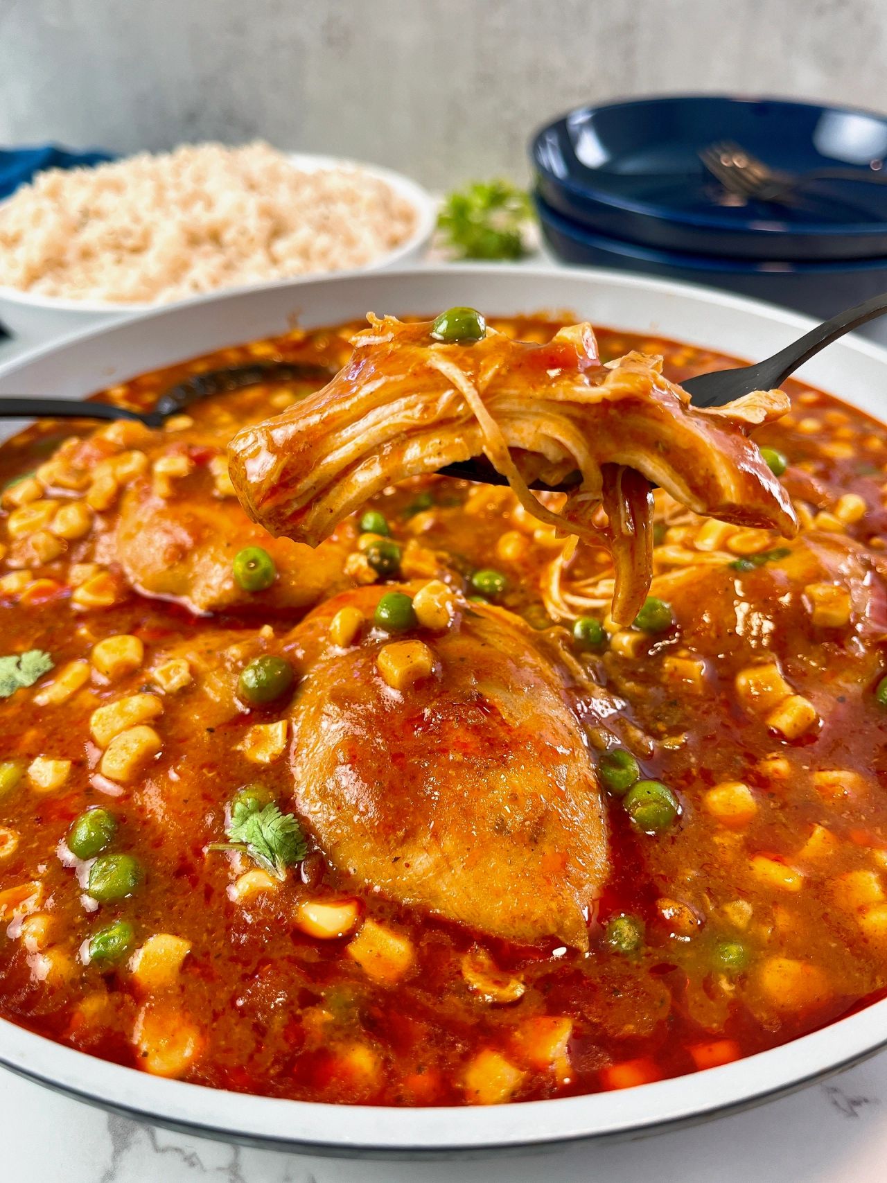 enchilada chicken thighs with corn and peas
