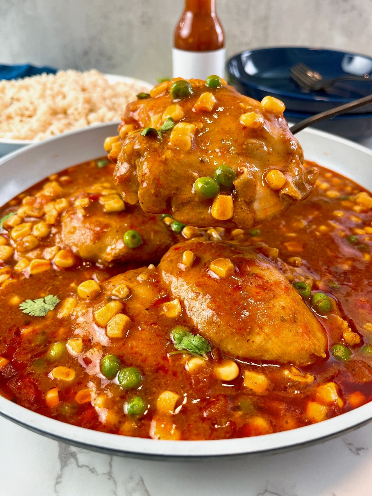 enchilada chicken thighs with corn and peas