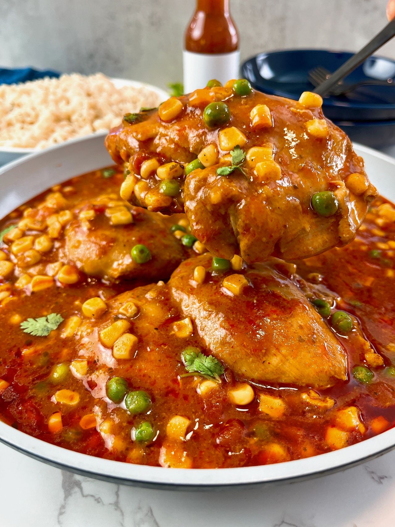 enchilada chicken thighs with corn and peas