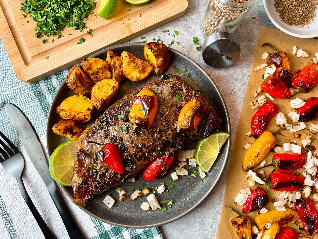 steak with roasted peppers and onions