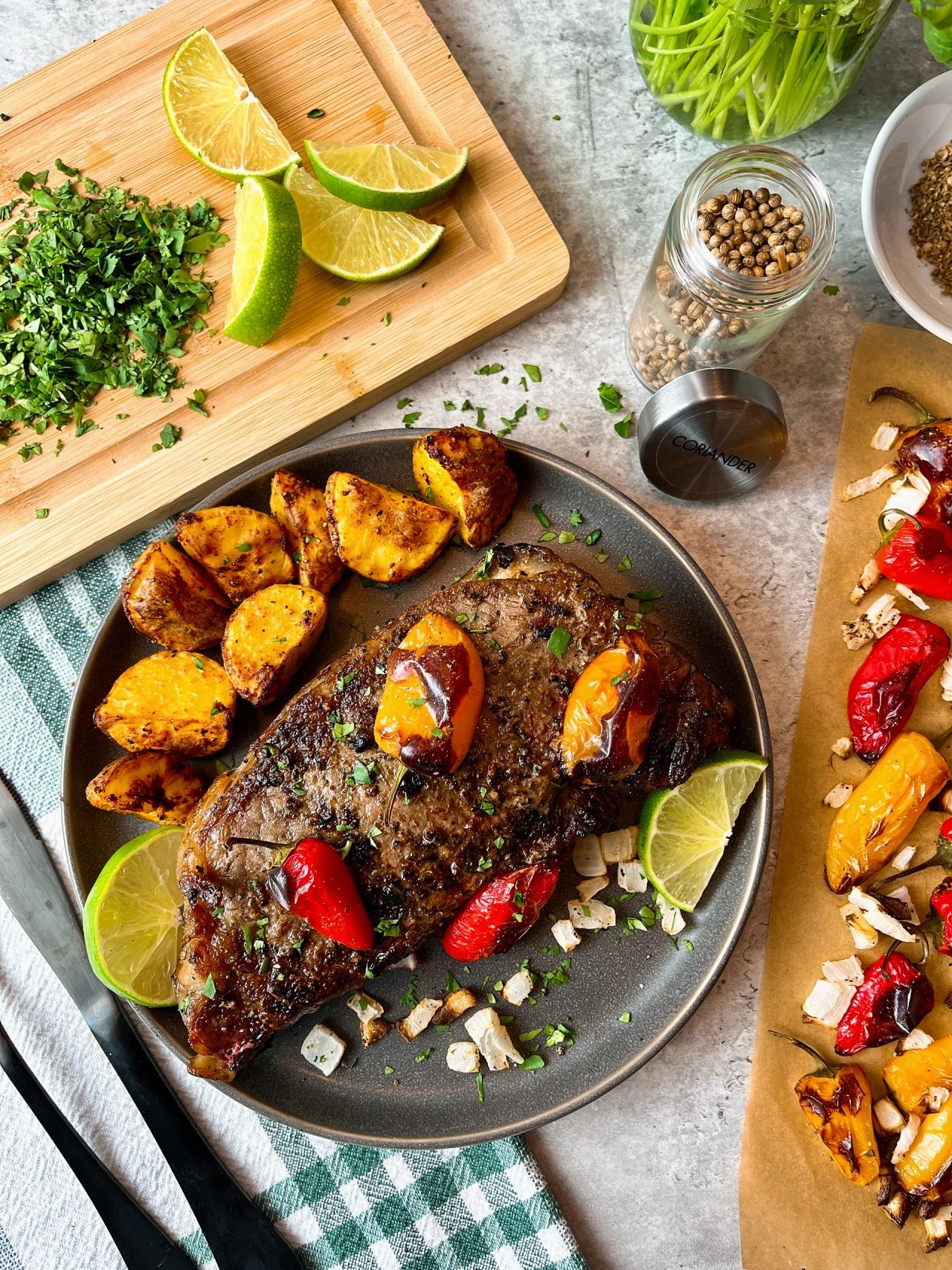 steak with roasted peppers and onions