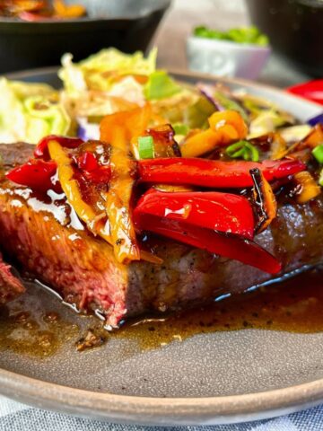 steaks with sweet and sour peppers