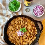 beer braised chicken in a skillet