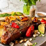 steak with roasted peppers and onions