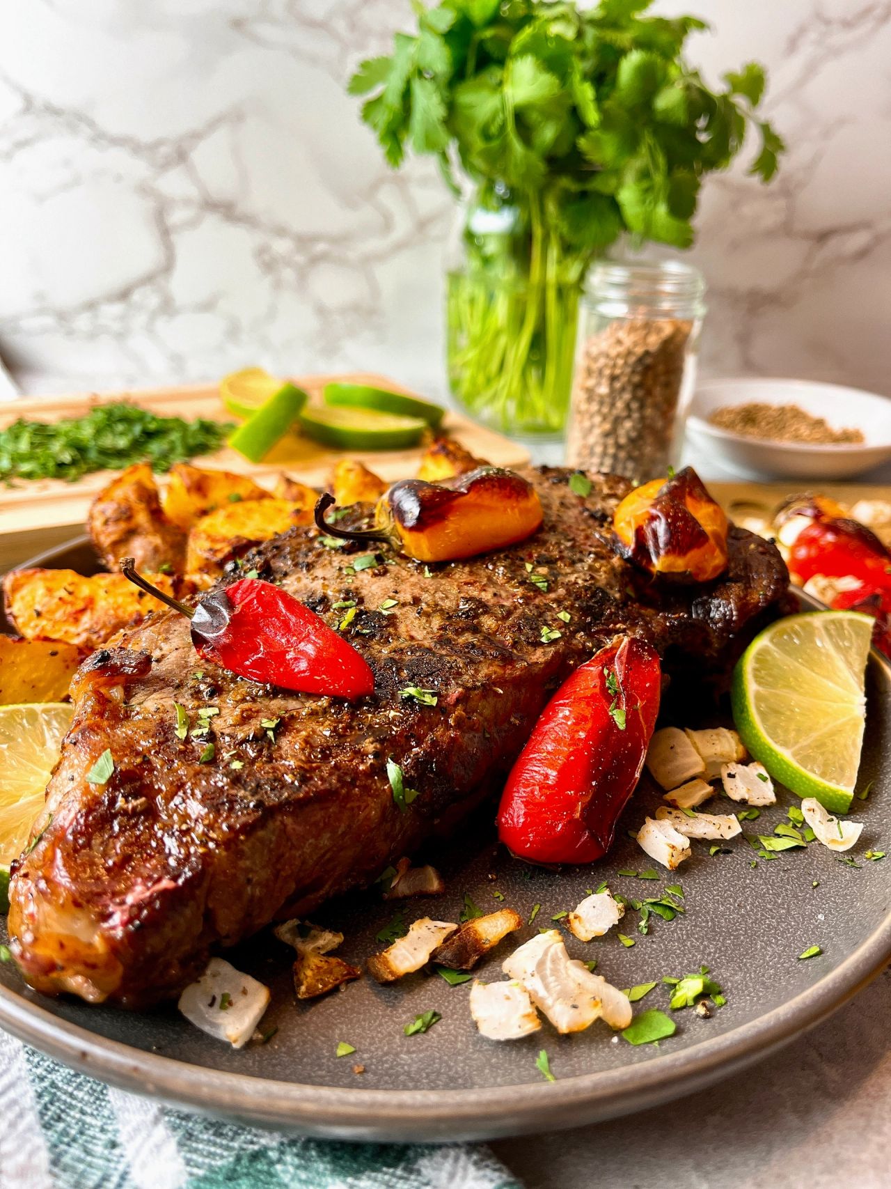 steak with roasted peppers and onions