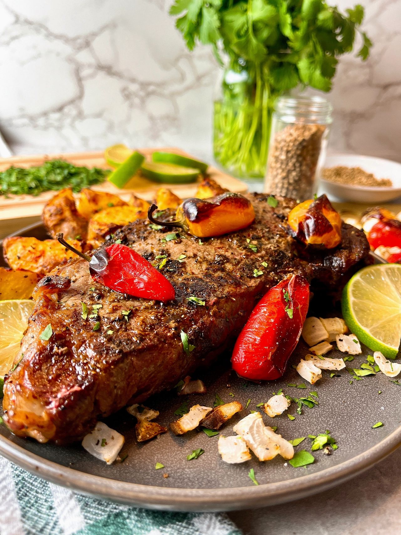 steak with roasted peppers and onions