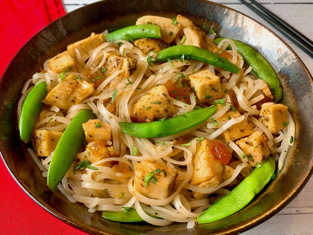 sweet and sour chicken with rice noodles