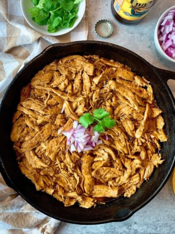 beer braised chicken in a skillet